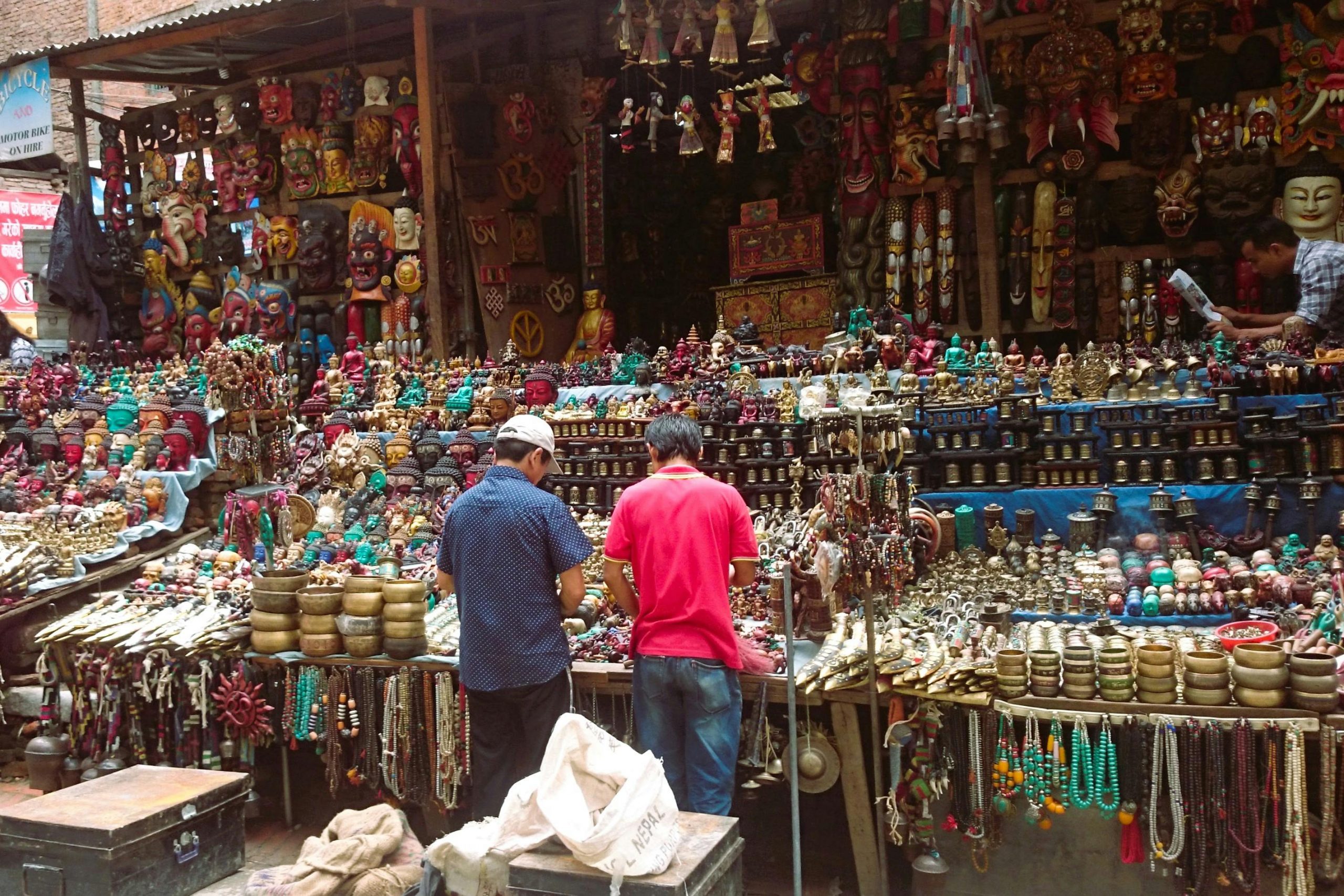 Handcrafted traditional arts and crafts in Kathmandu, Nepal, featuring intricate wood carvings, pottery, and colorful textiles, showcasing the rich cultural heritage of the region.