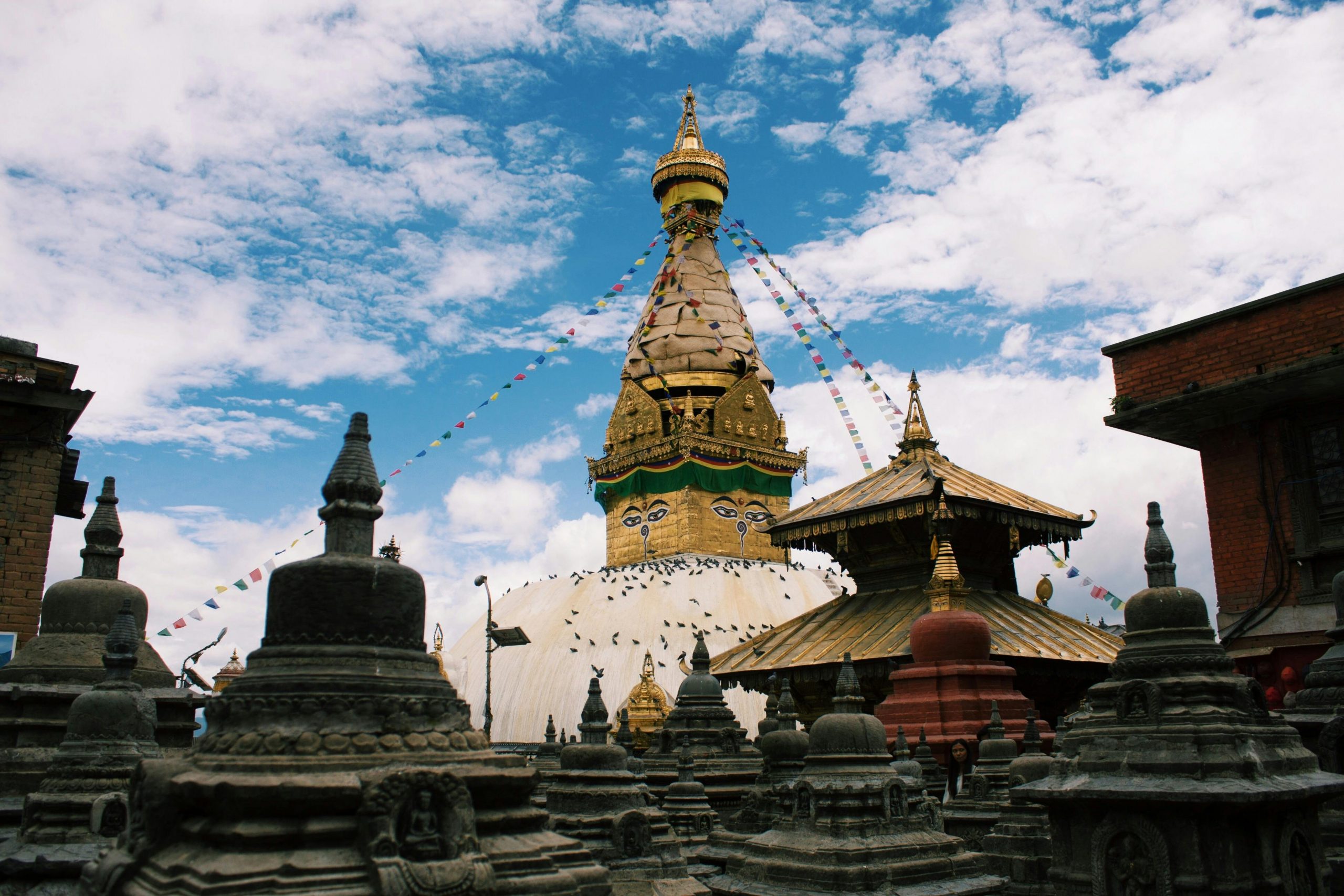 Swayambhunath Stupa, also known as the Monkey Temple, offering panoramic views of Kathmandu Valley, with its iconic golden spire and colorful prayer flags in Nepal.