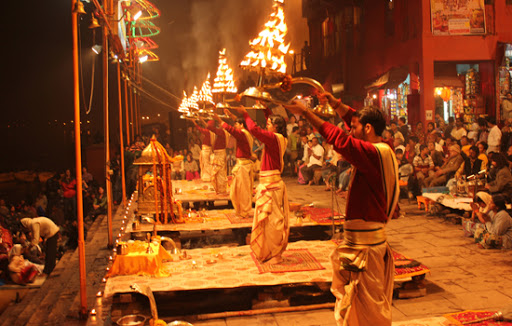 The Pashupatinath Bagmati Aarati ceremony, with priests performing rituals by the river, surrounded by incense smoke, lights, and devotees at the Pashupatinath Temple in Kathmandu, Nepal.