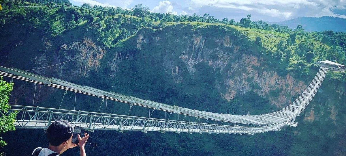 The Kushma Bungee Jumping bridge in Nepal, a high suspension bridge spanning a deep gorge, offering one of the tallest bungee jumps in the world.