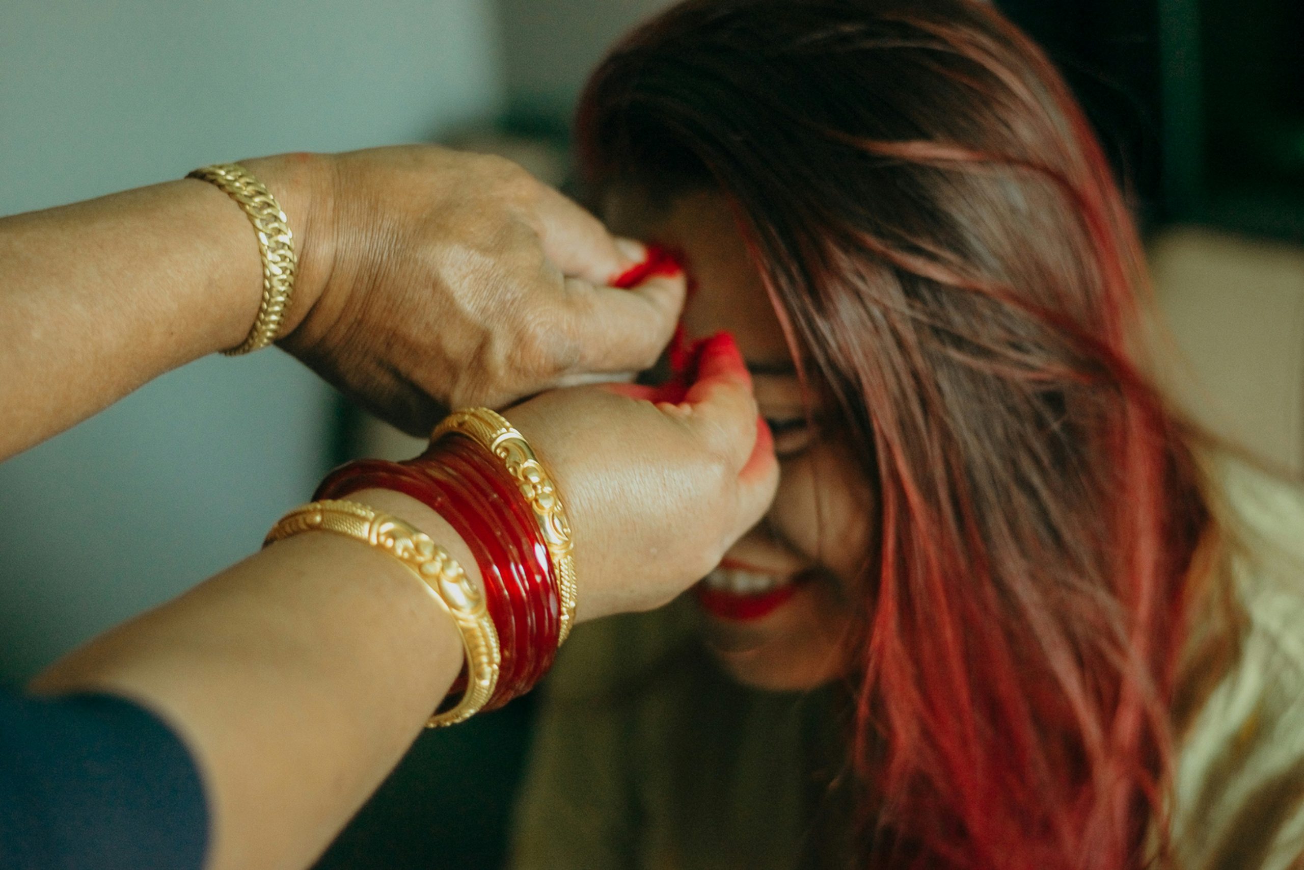 Nepalese girl receiving tika during day 10 - vijaya dashami of dashain